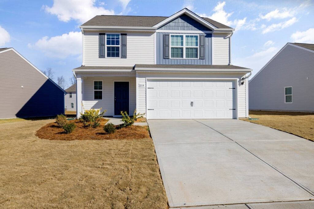 White and Blue House Under Blue Sky fix by Garage Door Repair Ipswich, MA